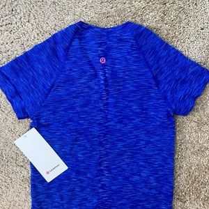 Brand new limited edition Swiftly Tech Short Sleeve 2.0 in race length size 4!